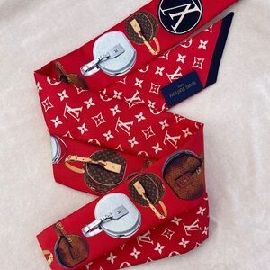 Louis Vuitton Red Scarf with Monogram and Luggage Print. 100% silk